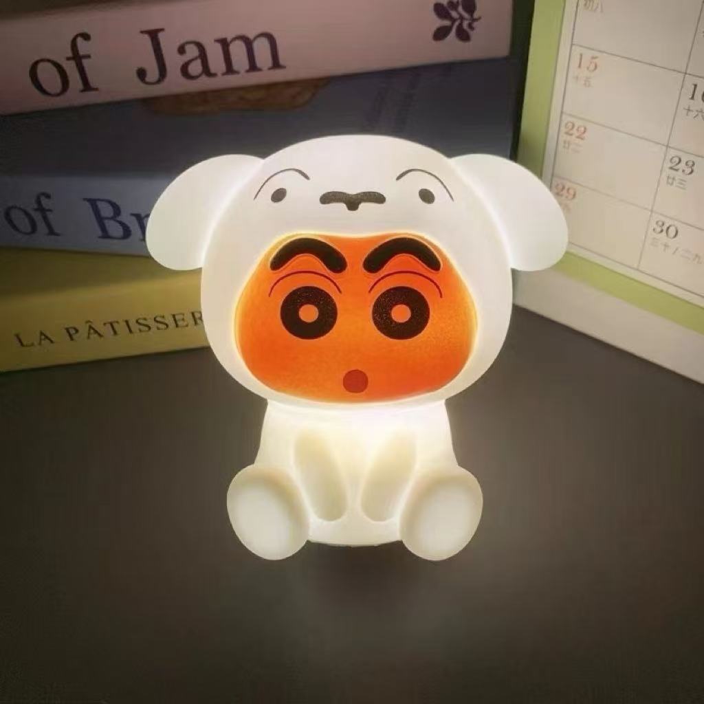 Shin-chan slap-slap night light glowing on a bedside table