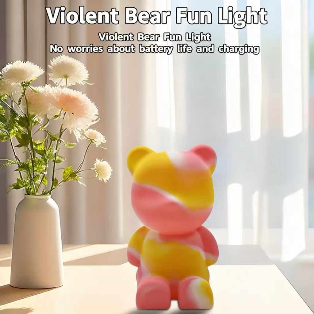 Bear-shaped silicone night light on a bright tabletop with flowers